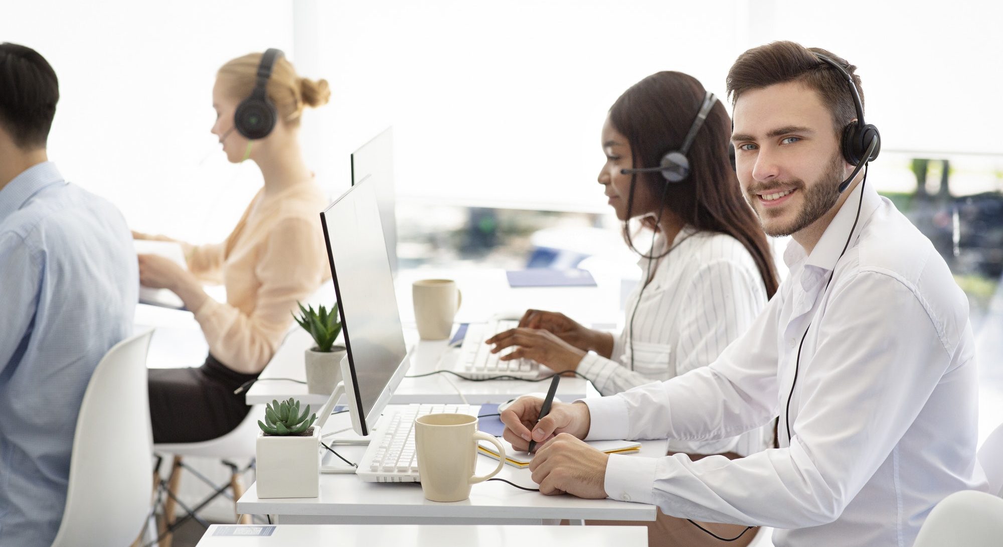 Diverse customer service operators helping clients, resolving technical issues or selling goods at